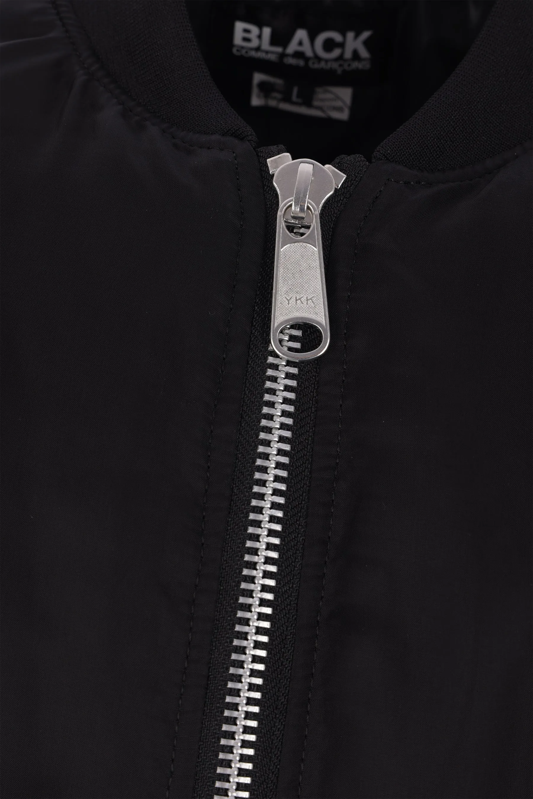 reversible asymmetrical bomber jacket.